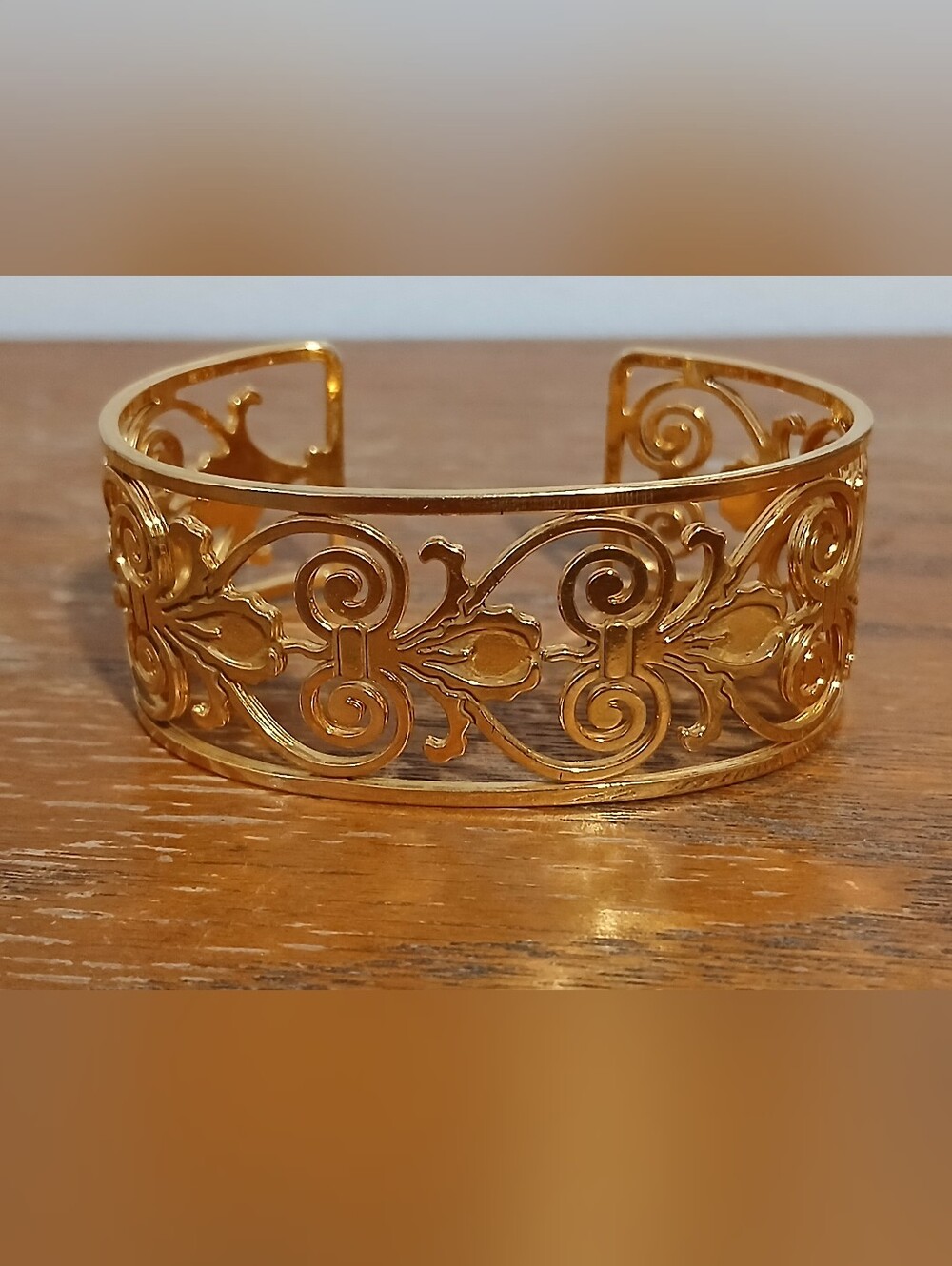 gold-tone metal cuff bracelet open work scroll floral pattern